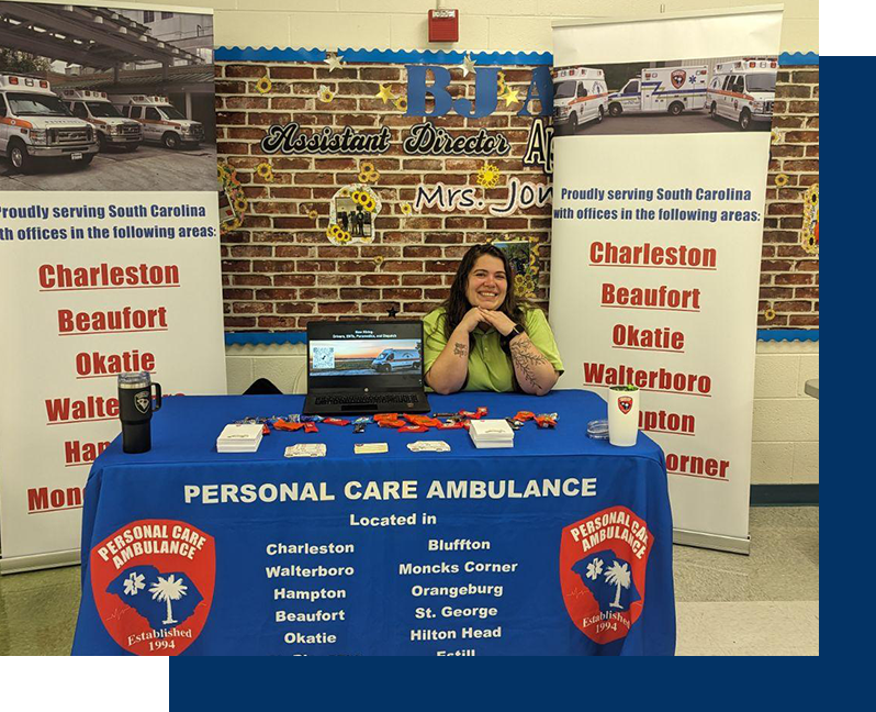 A woman sitting at the table of personal care ambulance.